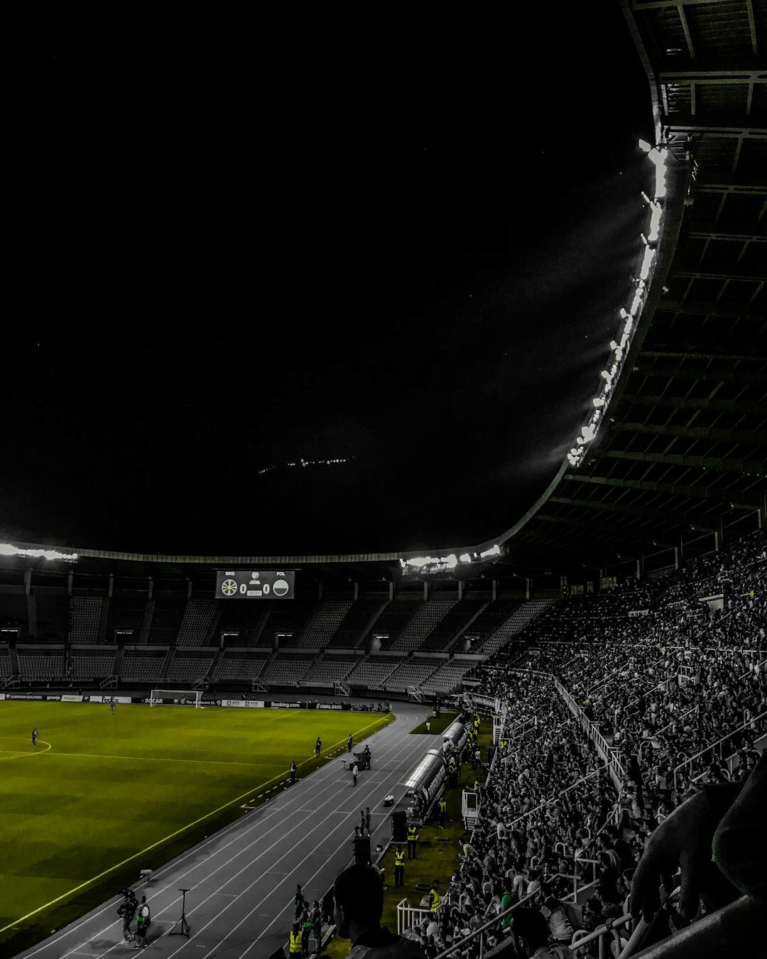 Football stadium at night with bright floodlights